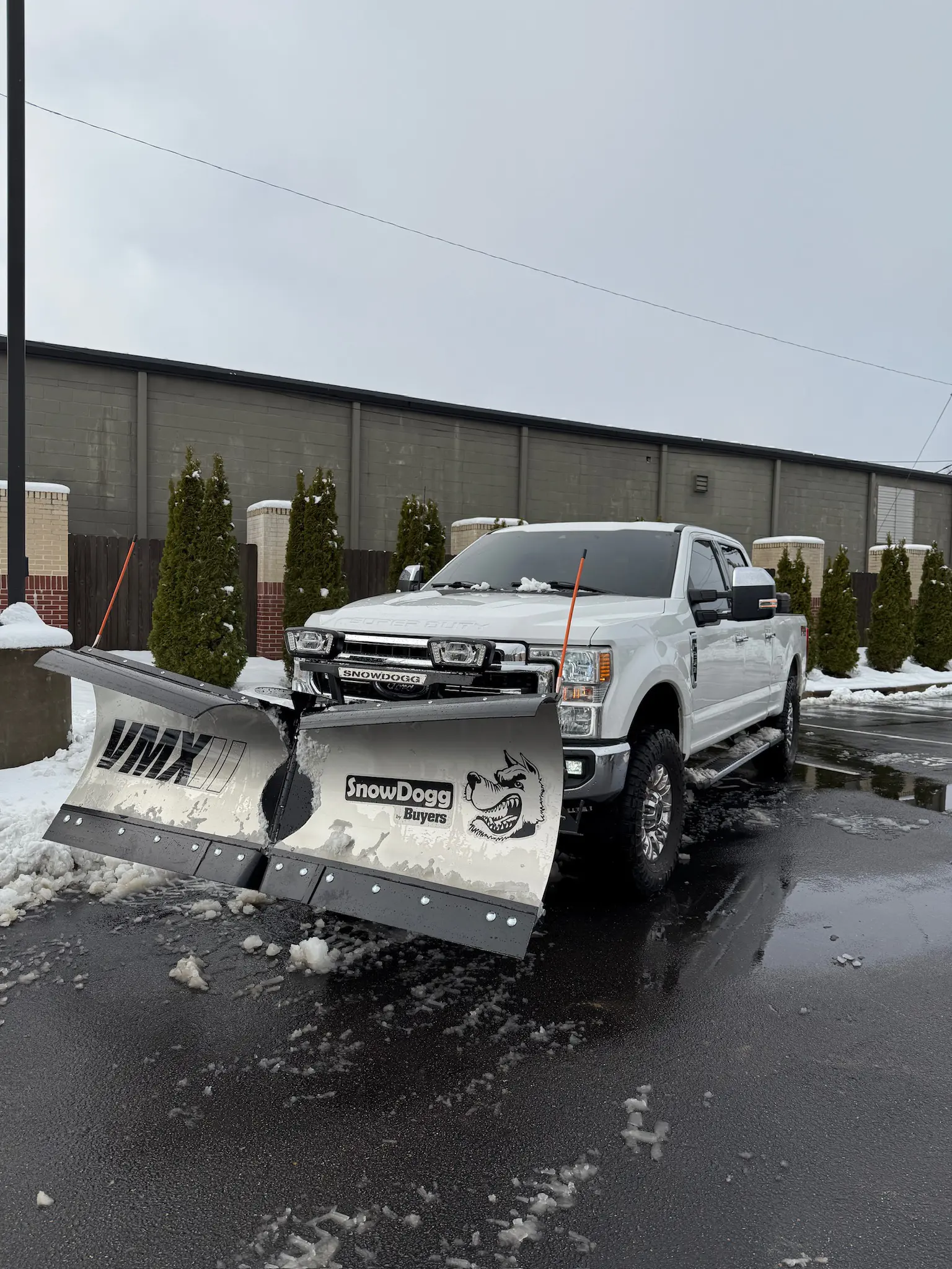 Green Earth Landscaping and Irrigation snow plow truck providing commercial snow removal and ice management in Memphis, TN.