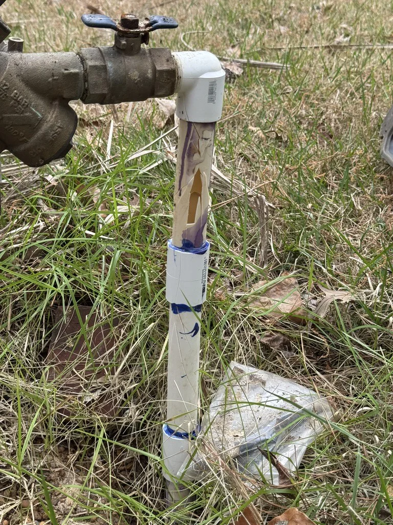 Freeze-shattered PVC irrigation pipe in Memphis showing DIY winterization failure