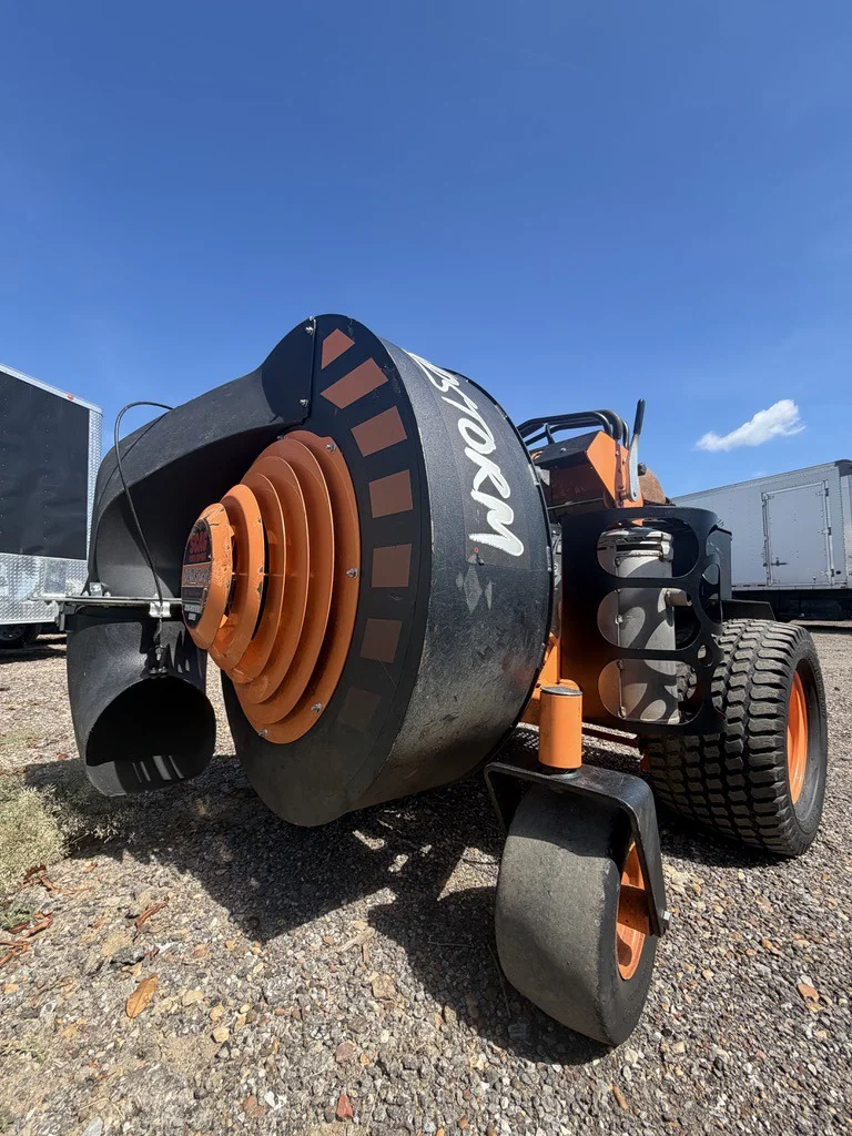 Orange commercial STORM leaf and debris blower used by Green Earth LLC for large leaf removals in Memphis TN